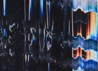 Glitch texture. Static noise. Distressed display. Red blue orange color analog defect dust scratches on dark black illustration abstract background.