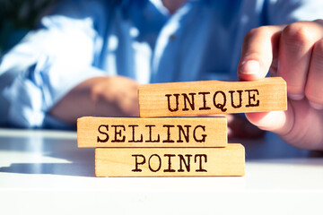 Wooden blocks with words 'Unique Selling Point'.