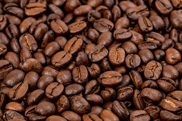 Coffee beans close up. Roasted coffee beans, can be used as background. Fragrant Arabica coffee.