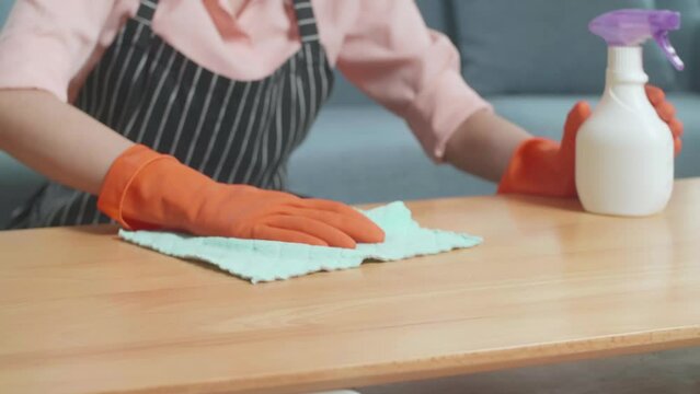 Close Up Of Female Housekeeper'S Hands Cleaning The Table By The Spray At Home
