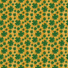 Green and gold shamrock on seamless background