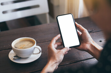 cell phone blank white screen mockup.hand holding texting using mobile on desk at office.background empty space for advertise.work people contact marketing business,technology