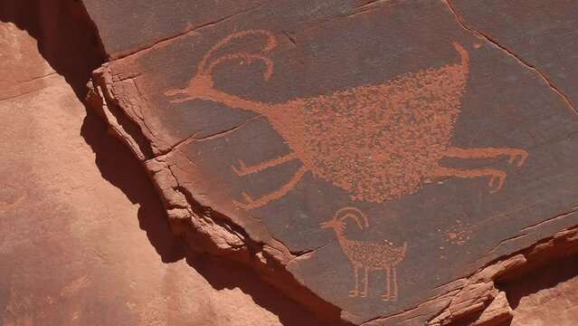 Famous carved Anasazi petroglyphs representing two animals
Monument Valley Utah USA, 2021
