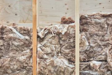 Foto op Plexiglas Insulation of a Dutch wall with natural sheep wool © Martin Bergsma