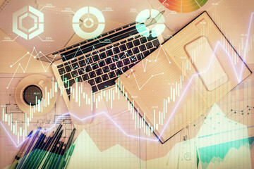 Multi exposure of forex chart drawing over table background with computer. Concept of financial research and analysis. Top view.