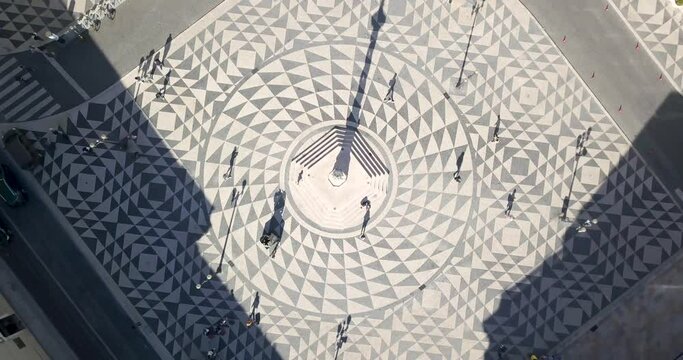 Aerial orbit top down View of municipio do com&eacute;rcio with some tourist visiting Lisbon, Portugal. amazing  Traditional Portuguese pavement.