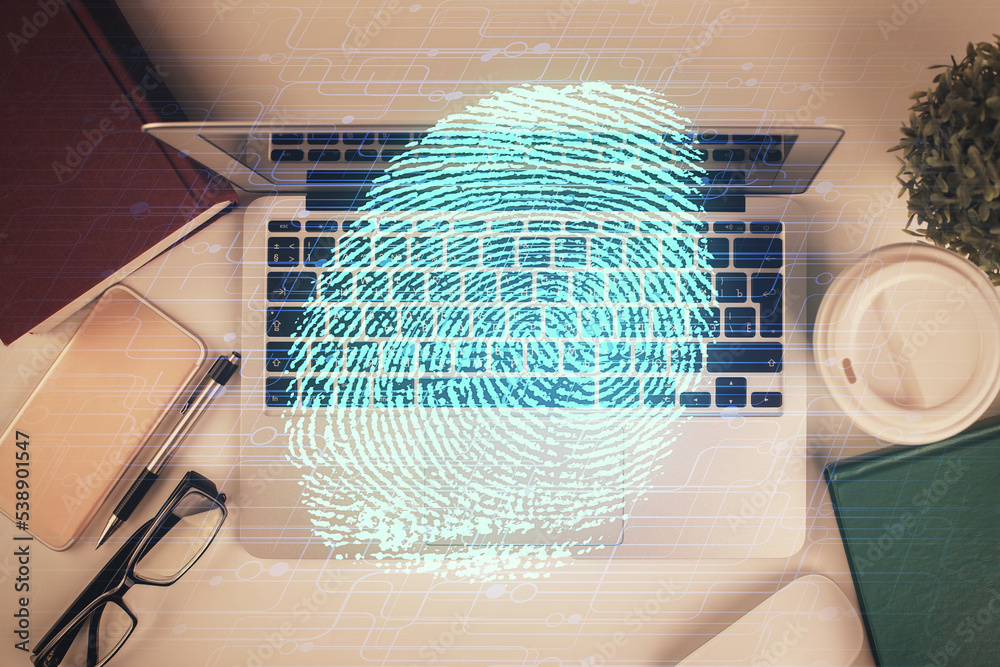 Aufkleber Finger print over computer on the desktop background. Top view. Double exposure. Concept of securitization.