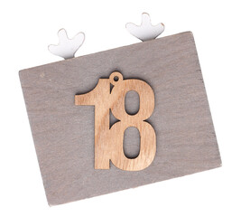 Wooden number eighteen, eighteenth December, Advent calendar, wooden number on a transparent...
