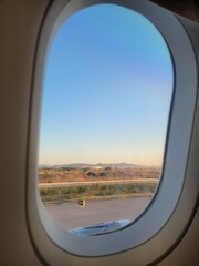 Fototapeta premium View from airplane window in the runway