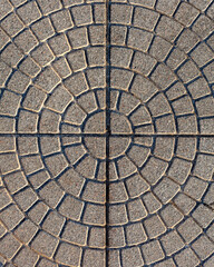 The floor tiles line the bricks in a beautiful circle.