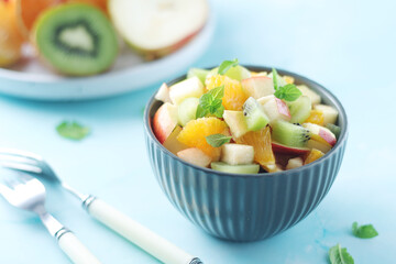 A bowl with fresh fruit salad	
