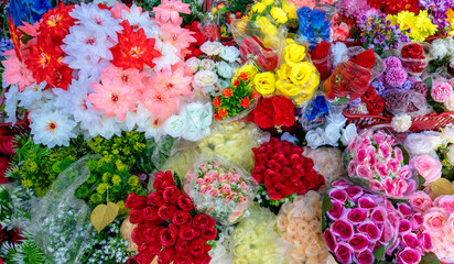  colorful bunches of artificial flowers arranged for sale in Slovakia