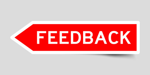 Red color arrow shape sticker label with word feedback on gray background