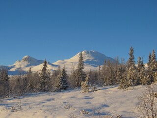 Mountain view of snow covered winter wonderland in Tuddal, Norway