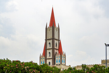 A red gothic steeple church building