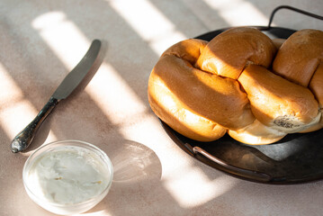 Challah Shabbat braided bread with silver knife and cottage cheese. Traditional Meal for Jewish cuisine Friday or Saturday dinner. 