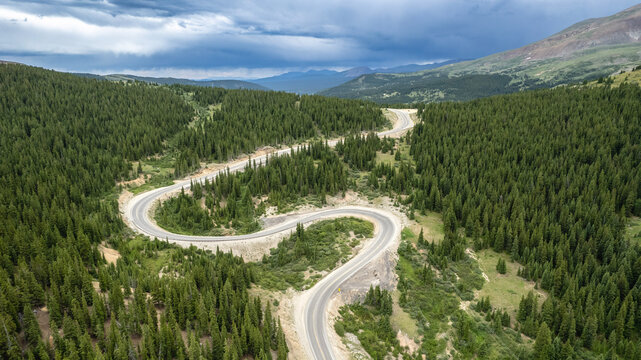 Aerial View of Winding S-Cuve Mountain Road Through Pne Forest