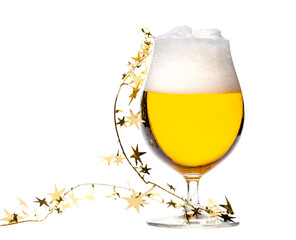 Tulip glass of beer with christmas tinsel isolated