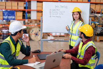 Group of worker in the warehouse factory conduct toolbox talk daily meeting focus on safety...