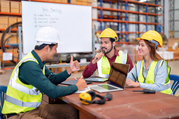 Group of worker in the warehouse factory conduct toolbox talk daily meeting focus on safety...