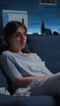Vertical video: Upset, frustrated, depressed woman lost in phychotic thoughts thinking of loneliness having anxiety, mental problems, chronic disease looking in distance suffer from major depression