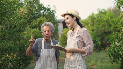 Agricultural concept of 4k Resolution. Aunt teaching her niece to make a garden.