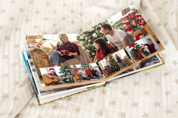 Naklejka na ściany i meble young family photobook of Christmas