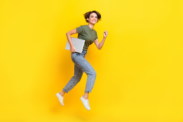 Full length photo of charming positive lady walk empty space hurry black friday sale modern device shop isolated on yellow color background