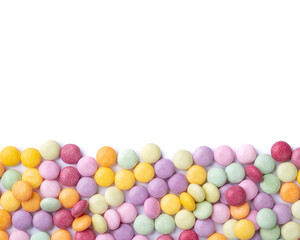 Colorful candies over white background with copy space