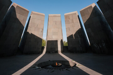 Eternal Flame inside the Tsitsernakaberd Memorial Complex on sunny evening. Yerevan, Armenia.