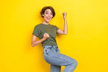 Photo of lovely adorable ecstatic girl with bob hairstyle wear khaki t-shirt scream yes win lottery...