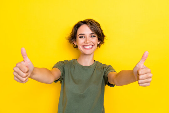 Close up photo of overjoyed pretty lady stylish wear arms demonstrate yes symbol low price shop sale isolated on yellow color background