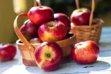 Red apples in wooden wicker basket