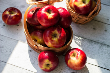 Red apples in wooden wicker basket