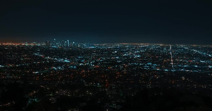 Los Angeles skyline timelapse at night. Big city in the USA. Skyscrapers and street lights with traffic