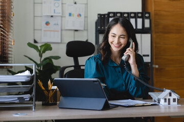 Home loan contract. house model on workplace desk with real estate agent professional making...