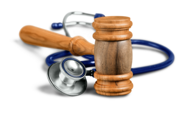 Gavel and stethoscope  on background, symbol photo for bungling and medical error