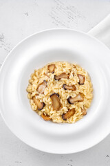 Portion risotto with mushrooms