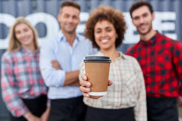 Portrait Of Team Working For Coffee Shop Or Distribution Business Standing By Shipping Container