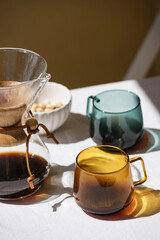 brew coffee device glass cups with drink on table