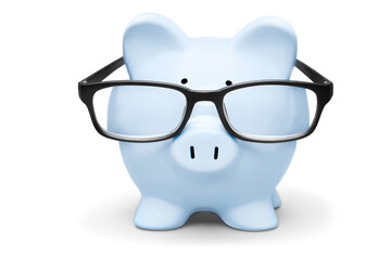 Blue piggy bank in glasses on background