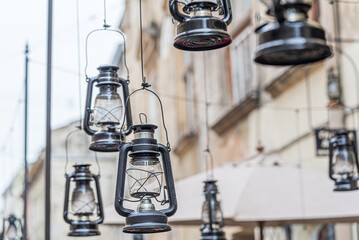 Fototapeta na wymiar Kerosene lamps as decor on the city street.