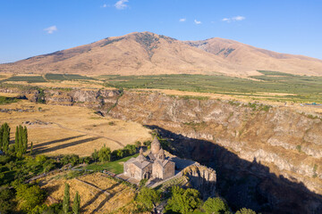 Aerial view of Saghmosavank monastery, Kasakh river canyon and Mount Ara on sunny summer day. Saghmosavan, Armenia.