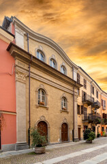 Fototapeta na wymiar Cuneo, Piedmont, Italy - October 14, 2022: Synagogue of Cuneo (17th-19th century) in Contrada Mondovì, ancient street of the district in the historic center at sunset