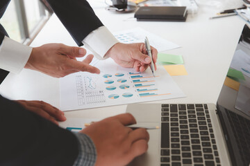 Business team meeting and discussing project plan. Businessmen discussing together in meeting room. Professional investor working with business project together.