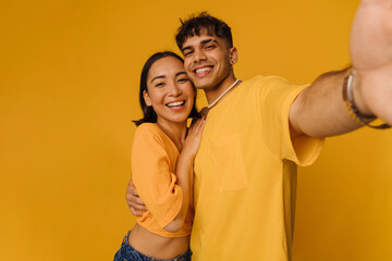 Obraz premium Selfie of young beautiful stylish smiling happy couple
