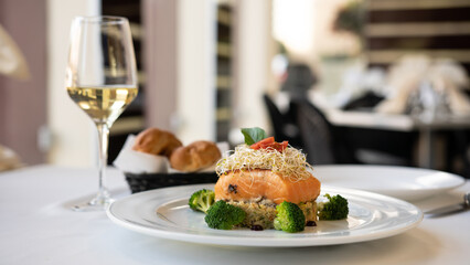 Beautiful served fish on a plate. With natural vegetables, and broccoli. Shabbat food.