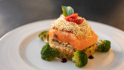 Beautiful served fish on a plate. With natural vegetables, and broccoli. Shabbat food.