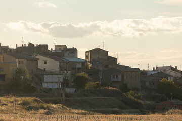 View of the houses, skyline, of the small village of Farasdues with sunset light in autumn, Aragon, Spain