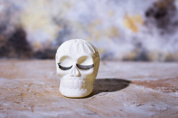 Cheerful Human skull with eyelashes. Background for copy space.